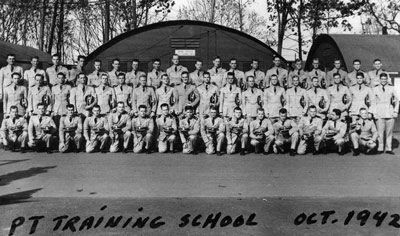 Motor Torpedo Boat Squadron Training Center, class of December 1942 (photo Oct. 1942), Mellville, RI.  Lt. (jg) John F. Kennedy is in the back row, seventh from right.