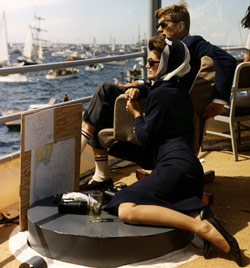 The President and Mrs. Kennedy view the first of the 1962 America's Cup races aboard the destroyer USS Joseph P. Kennedy Jr., off Newport, Rhode Island, 15 September 1962. Photograph by Robert Knudsen, White House, in the John F. Kennedy Presidential Library and Museum, Boston. 